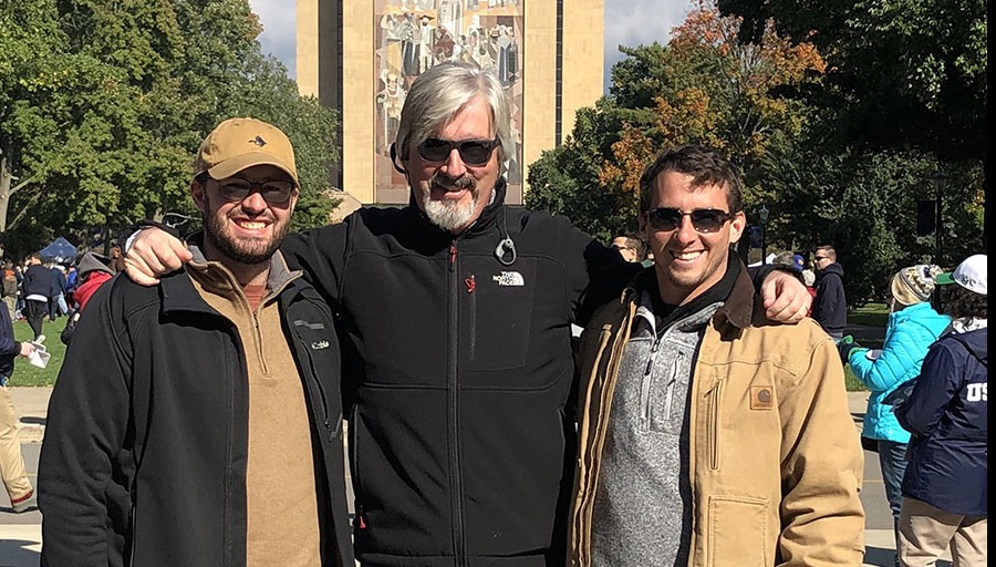 Christopher, Zachary, and me at Notre Dame Stadium in front of “Touchdown Jesus.”